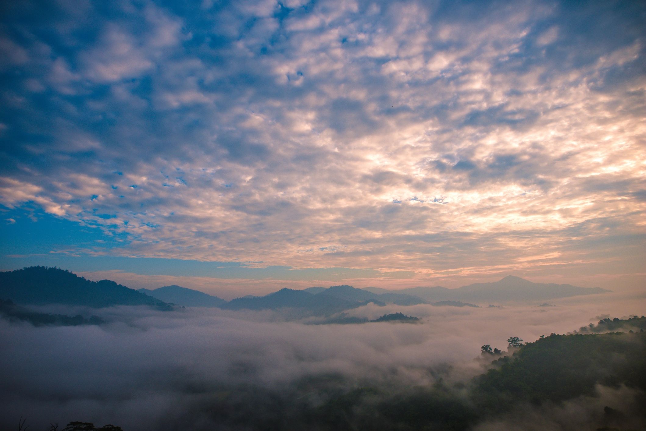 Sunrise over highland landscape with warm light