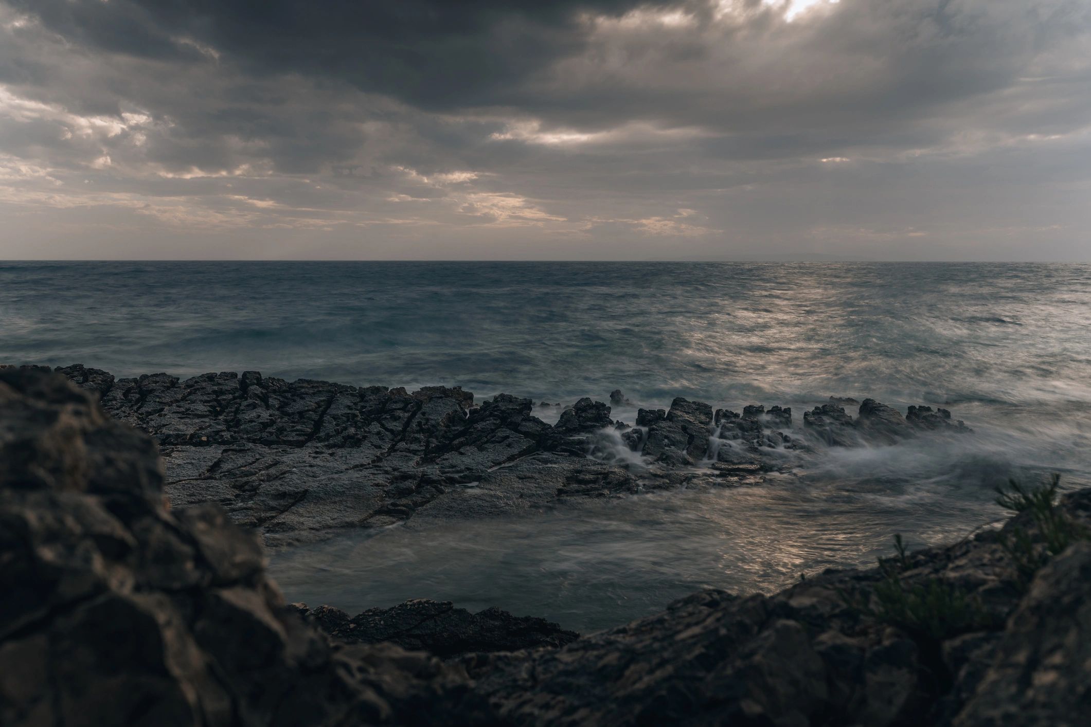 Waves crashing against coastal rocks