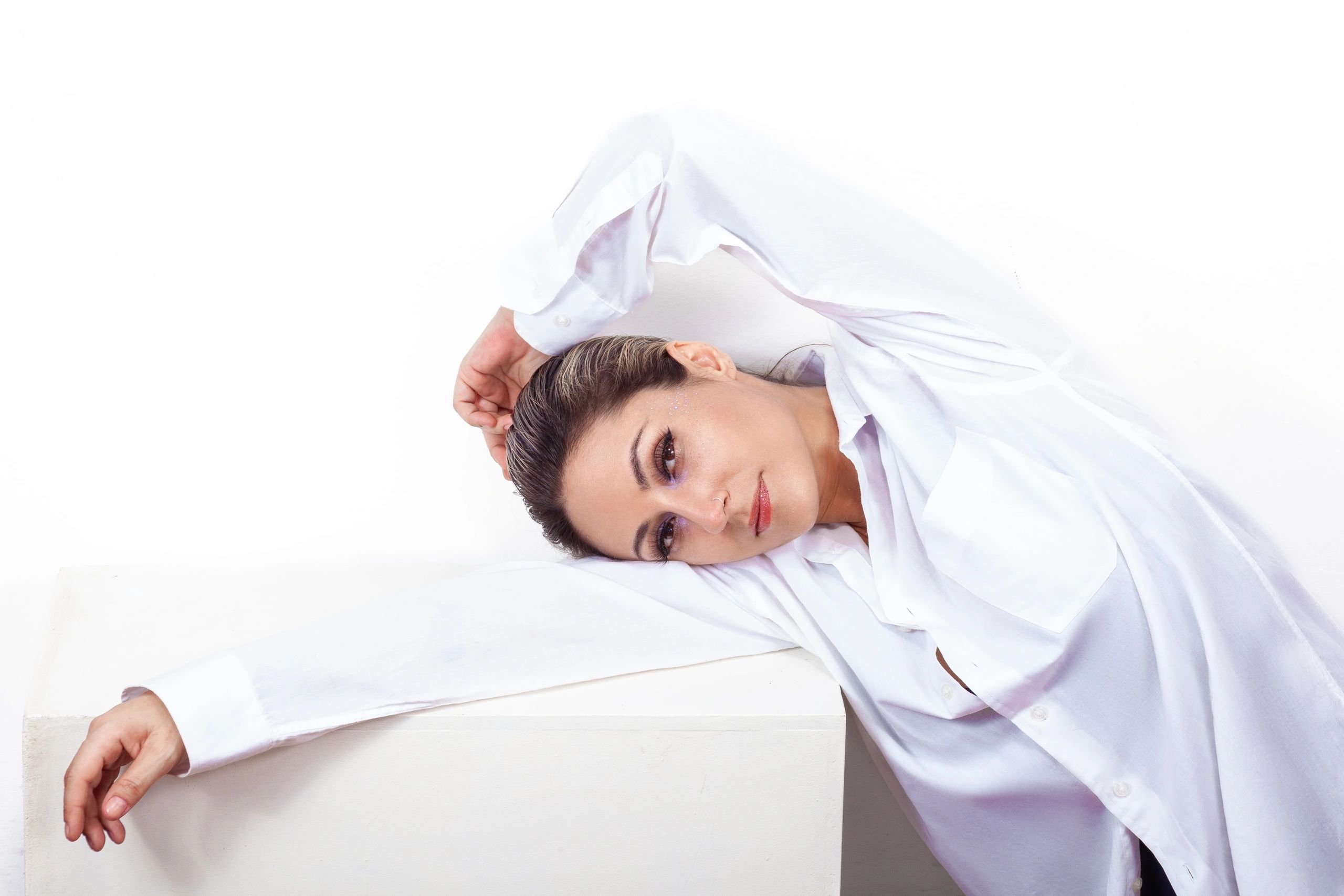 Studio portrait with soft white styling
