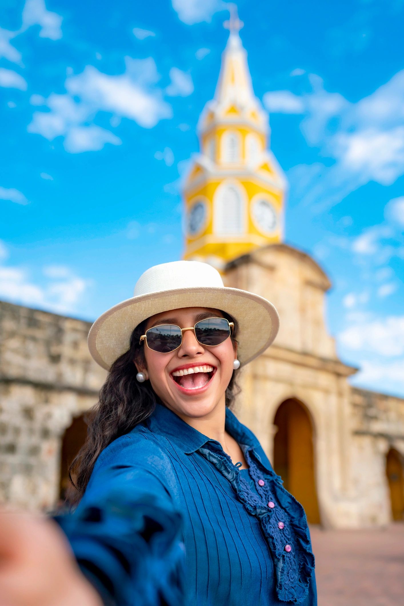 Traveler taking a selfie near Cartagena clock tower